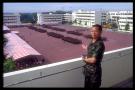 timothy hia yi liang on balcony presenting the parade formation on pop day