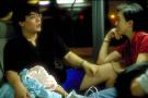 wmk & wife share a moment on bus ride back from china national day fireworks, with oi yin asleep in wmk's lap