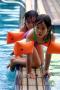 coco and kimber astride the pool divider, better