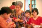 gong xi fa cai, hong bao kuai lai: elsie wong (6 soh) gives ang paos to grandchildren as ivan, son of yoke harn (daughter in law of wyl), looks on