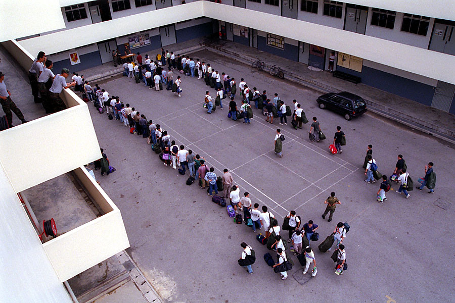 blur as sotong: first-day enlistees queue at the company line