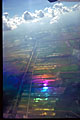 thai rice padi fields seen from the air with rainbow prismatic effect