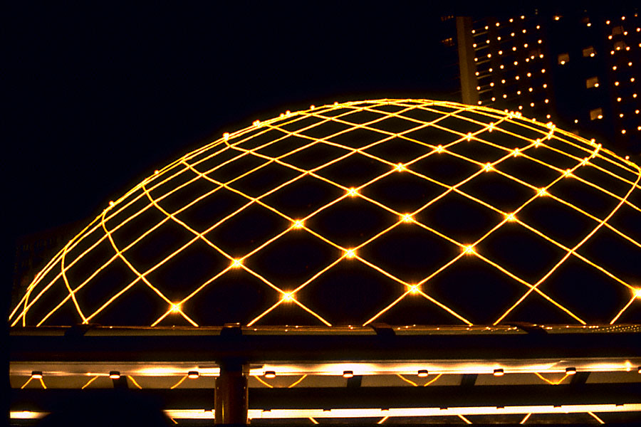 planetarium at night outlined in christmas lights